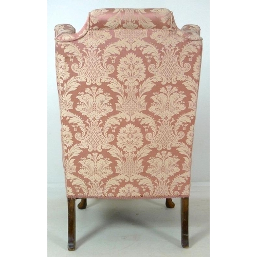 874 - A Queen Anne style wing back arm chair, early to mid 20th century, raised on carved cabriole front l... 