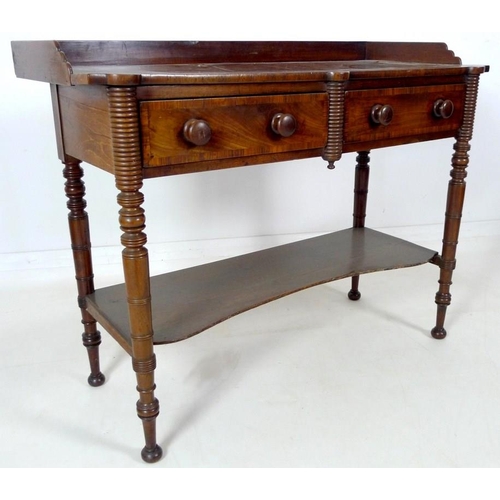 875 - A Victorian mahogany dressing table, with three quarter upstand, two frieze drawers, turned handles,... 