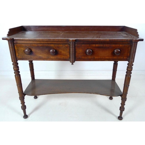 875 - A Victorian mahogany dressing table, with three quarter upstand, two frieze drawers, turned handles,... 