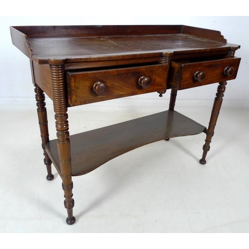 875 - A Victorian mahogany dressing table, with three quarter upstand, two frieze drawers, turned handles,... 