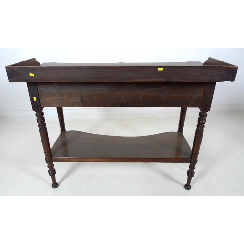 875 - A Victorian mahogany dressing table, with three quarter upstand, two frieze drawers, turned handles,... 