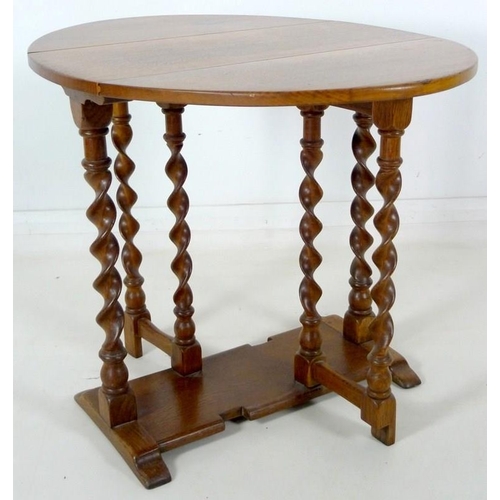 877 - A mid 20th century oak barley twist drop leaf occasional table, 68.5 by 90 by 69cm high.