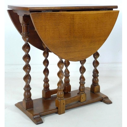 877 - A mid 20th century oak barley twist drop leaf occasional table, 68.5 by 90 by 69cm high.