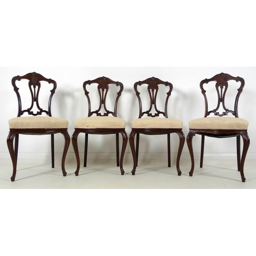 880 - A set of four early 20th century mahogany dining chairs, carved and moulded frames, pierced splats, ... 