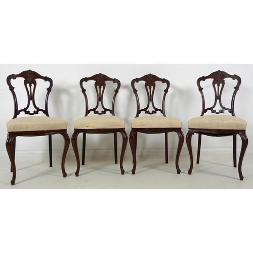 880 - A set of four early 20th century mahogany dining chairs, carved and moulded frames, pierced splats, ... 