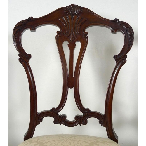 880 - A set of four early 20th century mahogany dining chairs, carved and moulded frames, pierced splats, ... 