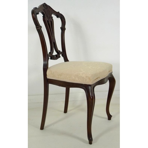 880 - A set of four early 20th century mahogany dining chairs, carved and moulded frames, pierced splats, ... 