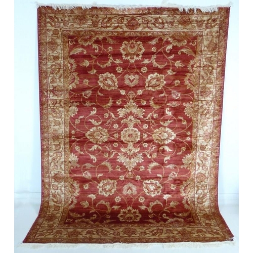 881A - A modern Zeigler rug with red ground and cream scrolling foliate decoration, 280 by 200cm.