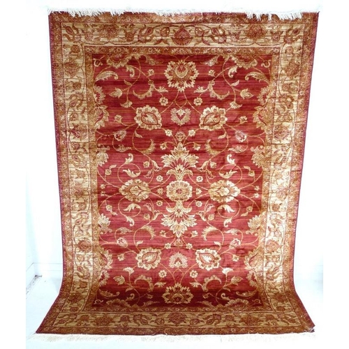 881A - A modern Zeigler rug with red ground and cream scrolling foliate decoration, 280 by 200cm.