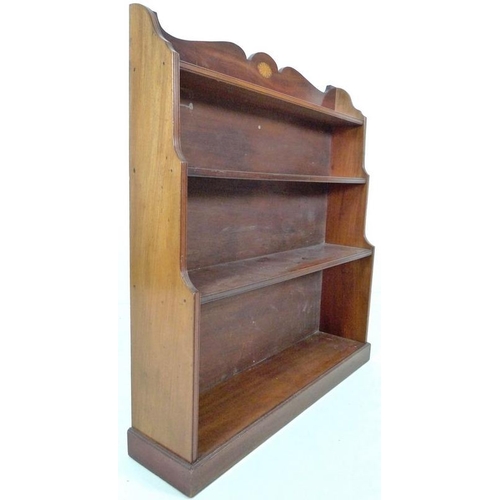 883 - An Edwardian mahogany waterfall freestanding bookcase, inlaid fan paterae decoration to the shaped g... 