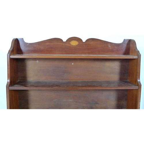 883 - An Edwardian mahogany waterfall freestanding bookcase, inlaid fan paterae decoration to the shaped g... 