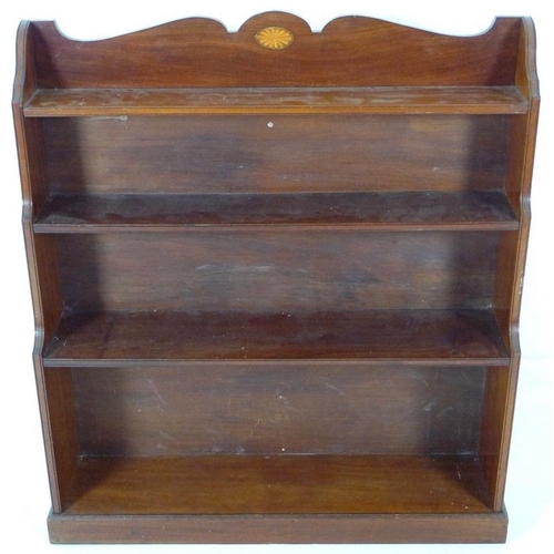 883 - An Edwardian mahogany waterfall freestanding bookcase, inlaid fan paterae decoration to the shaped g... 