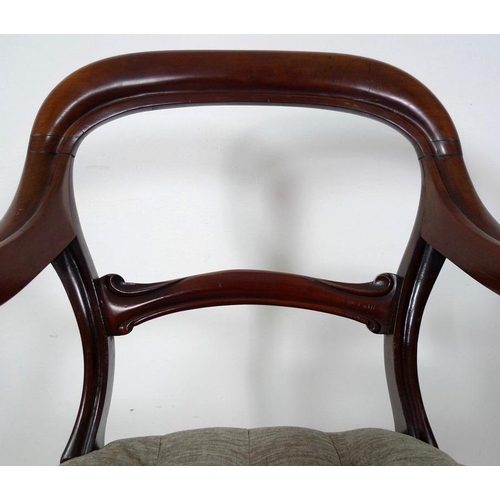 884 - A pair of 19th century open armed library chairs, by Gillows, shaped backs with scroll arms, the sea... 