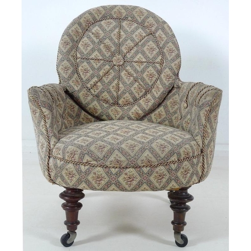 885 - A Victorian nursing chair, with shield shaped back, turned front legs and modern castors, upholstere... 