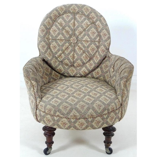 885 - A Victorian nursing chair, with shield shaped back, turned front legs and modern castors, upholstere... 