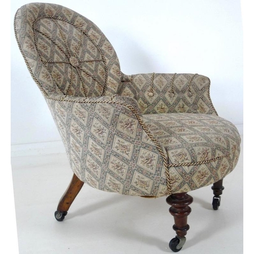 885 - A Victorian nursing chair, with shield shaped back, turned front legs and modern castors, upholstere... 