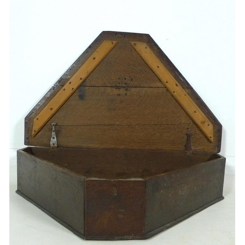 890A - A late 18th or 19th century triangular oak box, sides stamped with bead cross design, 71 by 42.5 by ... 