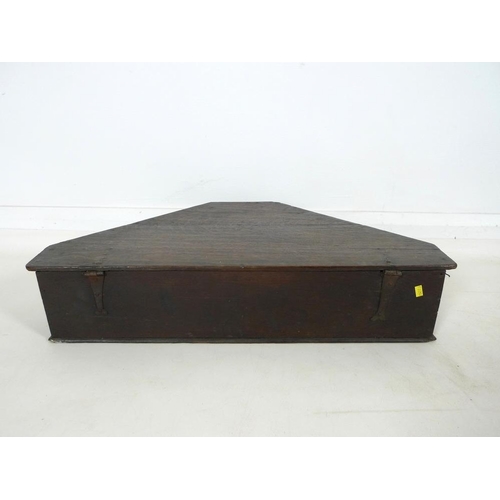 890A - A late 18th or 19th century triangular oak box, sides stamped with bead cross design, 71 by 42.5 by ... 