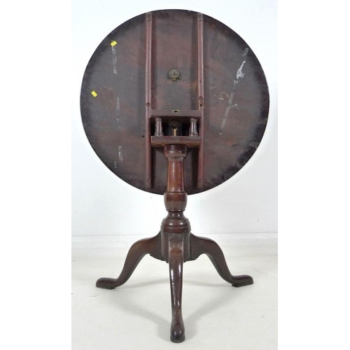 891 - A Georgian with later amendments birdcage tripod table, with circular surface, baluster support and ... 