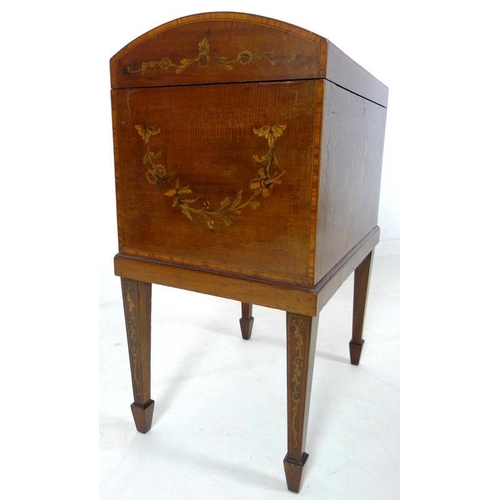 897 - A Victorian mahogany cellerette, inlaid, crossbanded and penwork decorated with musical and floral m... 