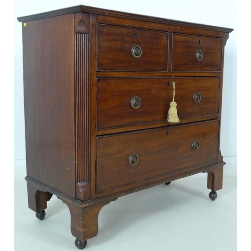 900 - An early Victorian mahogany chest of two short over two long drawers, with cock beading and ring han... 