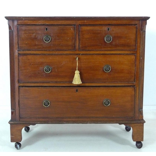 900 - An early Victorian mahogany chest of two short over two long drawers, with cock beading and ring han... 