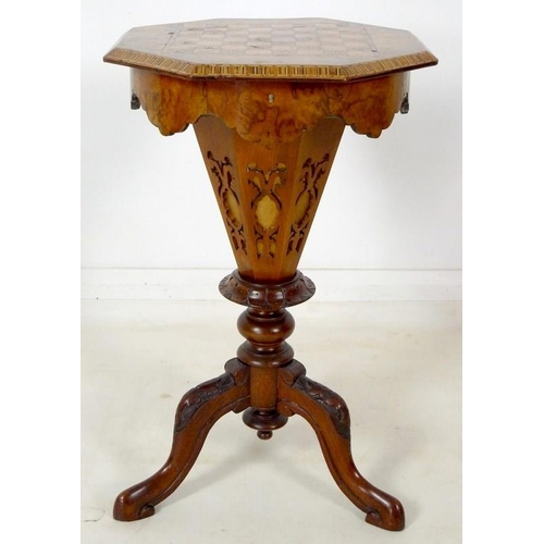 903 - A Victorian walnut veneered and inlaid work / games table, octagonal lift lid surface, fitted interi... 