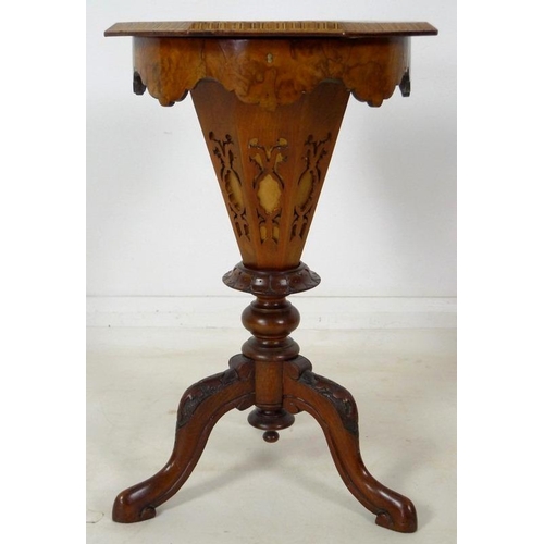 903 - A Victorian walnut veneered and inlaid work / games table, octagonal lift lid surface, fitted interi... 