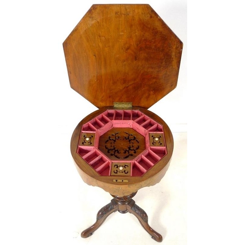 903 - A Victorian walnut veneered and inlaid work / games table, octagonal lift lid surface, fitted interi... 