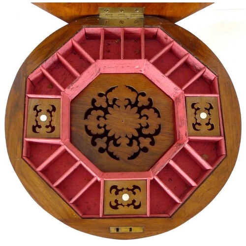 903 - A Victorian walnut veneered and inlaid work / games table, octagonal lift lid surface, fitted interi... 