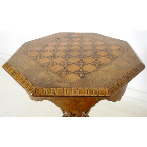 903 - A Victorian walnut veneered and inlaid work / games table, octagonal lift lid surface, fitted interi... 