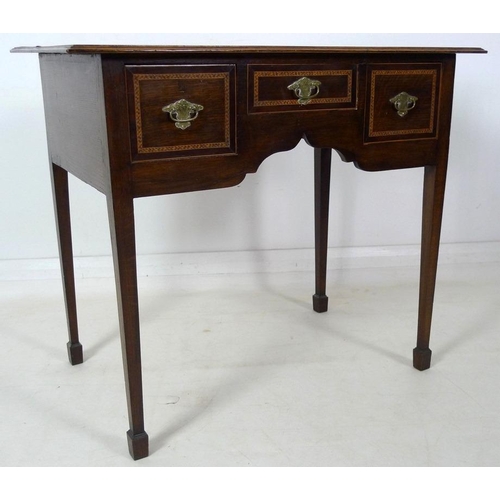 904 - A 19th century lowboy, moulded surface inlaid with feather banding, fitted with one dummy and two dr... 