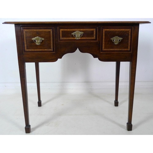 904 - A 19th century lowboy, moulded surface inlaid with feather banding, fitted with one dummy and two dr... 