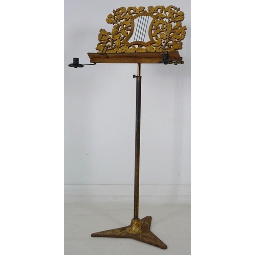 905 - A Regency painted wood and toleware music stand, circa 1820, fretwork carved stand with central styl... 