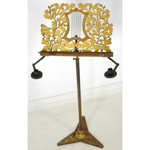 905 - A Regency painted wood and toleware music stand, circa 1820, fretwork carved stand with central styl... 