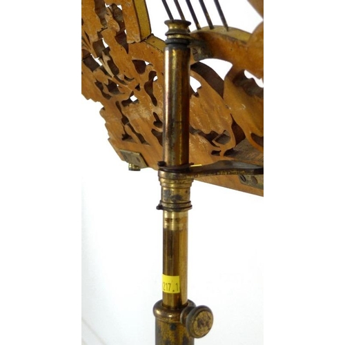 905 - A Regency painted wood and toleware music stand, circa 1820, fretwork carved stand with central styl... 