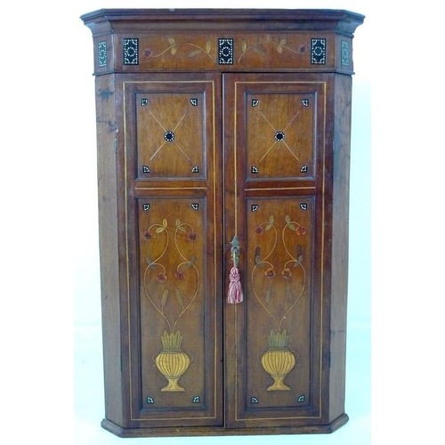 906 - An Edwardian mahogany flat fronted corner cupboard, inlaid with unusual decoration of ebony beads, v... 