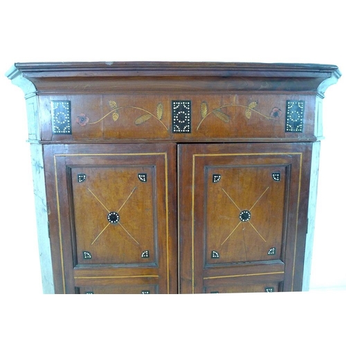 906 - An Edwardian mahogany flat fronted corner cupboard, inlaid with unusual decoration of ebony beads, v... 