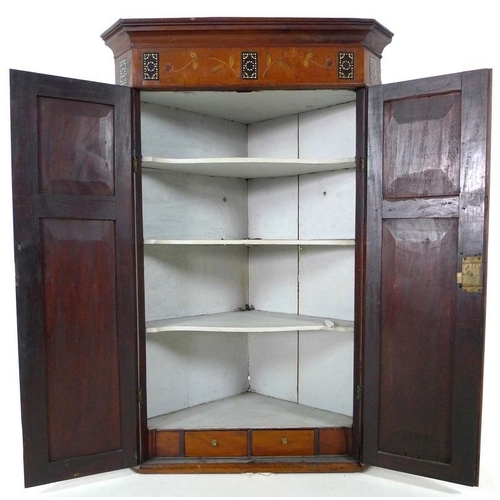 906 - An Edwardian mahogany flat fronted corner cupboard, inlaid with unusual decoration of ebony beads, v... 