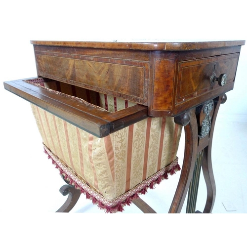 908 - An early 19th century mahogany worktable, inlaid with satinwood and crossbanded, with pull out uphol... 