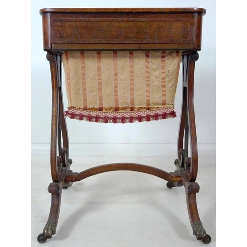 908 - An early 19th century mahogany worktable, inlaid with satinwood and crossbanded, with pull out uphol... 