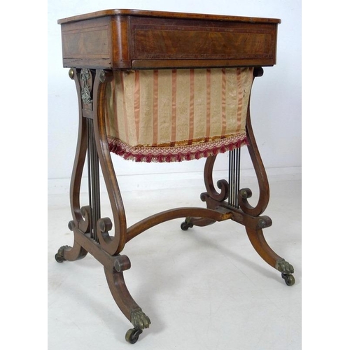 908 - An early 19th century mahogany worktable, inlaid with satinwood and crossbanded, with pull out uphol... 