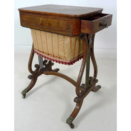 908 - An early 19th century mahogany worktable, inlaid with satinwood and crossbanded, with pull out uphol... 