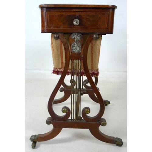 908 - An early 19th century mahogany worktable, inlaid with satinwood and crossbanded, with pull out uphol... 