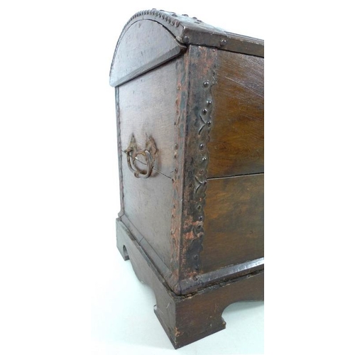 909 - An 18th century oak domed blanket chest with original intricate key, metal bound on a matched base, ... 