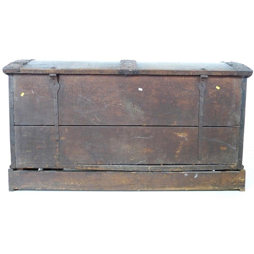 909 - An 18th century oak domed blanket chest with original intricate key, metal bound on a matched base, ... 