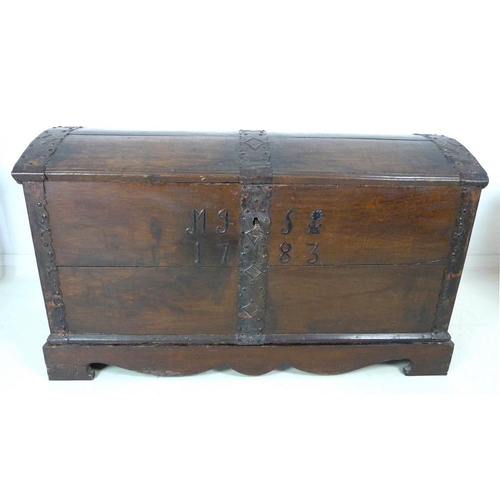 909 - An 18th century oak domed blanket chest with original intricate key, metal bound on a matched base, ... 