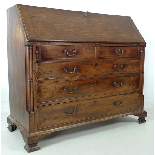 910 - A George III mahogany bureau, fall front with fitted interior, secret compartments, drawers and shel... 