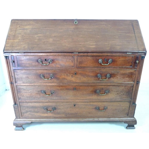 910 - A George III mahogany bureau, fall front with fitted interior, secret compartments, drawers and shel... 