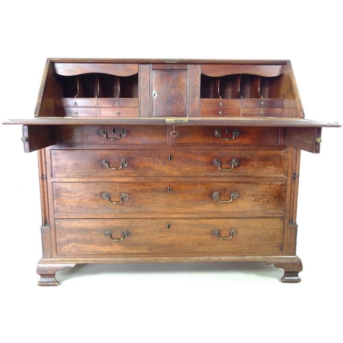 910 - A George III mahogany bureau, fall front with fitted interior, secret compartments, drawers and shel... 